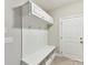 Mudroom features custom storage cubbies, built-in bench, and convenient access to the garage at 129 Overlook Ridge Ln, Davidson, NC 28036