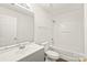 White bathroom featuring a single sink vanity, toilet, and shower/tub combo at 13408 Golden Apple Ct, Charlotte, NC 28215