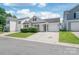 Exterior view of a house featuring a one-car garage and tidy landscaping at 13408 Golden Apple Ct, Charlotte, NC 28215