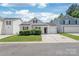 Charming single-Gathering home featuring a one-car garage and manicured landscaping at 13408 Golden Apple Ct, Charlotte, NC 28215