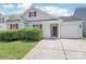 Inviting single-story home with an attached garage and neat front yard at 13408 Golden Apple Ct, Charlotte, NC 28215