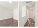 Inviting hallway with laminate flooring, neutral walls, and access to multiple rooms at 13408 Golden Apple Ct, Charlotte, NC 28215