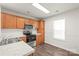 Well-lit kitchen featuring wood cabinets, white countertops, and stainless steel appliances at 13408 Golden Apple Ct, Charlotte, NC 28215