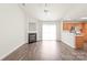 Open living area with a fireplace, dining space, and kitchen access at 13408 Golden Apple Ct, Charlotte, NC 28215