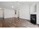 Spacious living room featuring a fireplace, ample lighting, and neutral decor at 13408 Golden Apple Ct, Charlotte, NC 28215