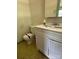 Cozy bathroom with a white sink vanity and toilet with a yellow-tiled floor at 140 Porter Rd, Statesville, NC 28625