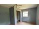 Bedroom featuring gray walls, painted trim, and a closet with sliding doors at 140 Porter Rd, Statesville, NC 28625