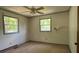 Bedroom with natural light from two windows and neutral walls with painted trim at 140 Porter Rd, Statesville, NC 28625