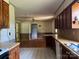 Cozy eat-in kitchen with wooden cabinets, neutral countertops and tile flooring at 140 Porter Rd, Statesville, NC 28625