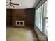 Living room featuring a brick fireplace, built-in shelves and lots of natural light at 140 Porter Rd, Statesville, NC 28625