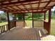 Wooden patio with a high ceiling roof, overlooking a big green yard at 140 Porter Rd, Statesville, NC 28625