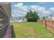 A spacious backyard featuring a green lawn and a shed for storage with ample green space at 14104 Kendrick Cross Rd, Charlotte, NC 28273
