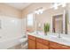 Bathroom featuring a double sink vanity, a shower-tub combo, and bright vanity lighting at 14104 Kendrick Cross Rd, Charlotte, NC 28273