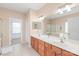 Bathroom featuring a double sink vanity, a large mirror, and a separate shower and tub at 14104 Kendrick Cross Rd, Charlotte, NC 28273
