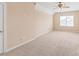 Spacious bedroom with a ceiling fan, neutral carpet and walls, and a bright window at 14104 Kendrick Cross Rd, Charlotte, NC 28273
