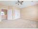 Large bedroom with neutral paint, carpet, ceiling fan and closet at 14104 Kendrick Cross Rd, Charlotte, NC 28273