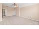 Comfortable bedroom with neutral walls, carpet, and a ceiling fan, conveniently located near doorways at 14104 Kendrick Cross Rd, Charlotte, NC 28273