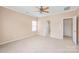 Spacious bedroom with neutral walls, carpet, a ceiling fan, and natural light at 14104 Kendrick Cross Rd, Charlotte, NC 28273