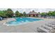 Large community pool surrounded by lounge chairs, perfect for relaxation and recreation on sunny days at 14104 Kendrick Cross Rd, Charlotte, NC 28273