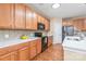 Charming kitchen with wood cabinets, white countertops, and stainless steel appliances at 14104 Kendrick Cross Rd, Charlotte, NC 28273