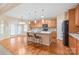 Open kitchen boasts a center island, wood cabinets and stainless steel appliances at 14104 Kendrick Cross Rd, Charlotte, NC 28273