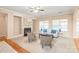 Comfortable living room with a fireplace, natural light, and stylish furniture at 14104 Kendrick Cross Rd, Charlotte, NC 28273