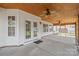 Charming covered patio with a wood ceiling, fan, and view of the backyard at 14104 Kendrick Cross Rd, Charlotte, NC 28273