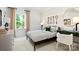 Bright bedroom features a large window with view, tennis decor, and neutral tones at 14210 Kershaw Cir # 20, Huntersville, NC 28078