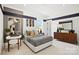 Stylish bedroom featuring a modern bed, hardwood floors, and a view to the home exterior at 14210 Kershaw Cir # 20, Huntersville, NC 28078