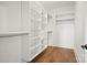 Spacious walk-in closet featuring built-in shelving and ample storage space at 14210 Kershaw Cir # 20, Huntersville, NC 28078