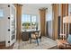 Bright home office featuring a modern desk, decor, and scenic outdoor views from large windows at 14210 Kershaw Cir # 20, Huntersville, NC 28078