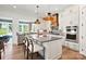 Spacious kitchen with large island, stainless appliances, and custom lighting at 14210 Kershaw Cir # 20, Huntersville, NC 28078