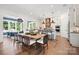 Open kitchen and dining area with stainless appliances, custom cabinets, and modern lighting at 14210 Kershaw Cir # 20, Huntersville, NC 28078