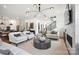 Bright living room with fireplace, modern staircase, and open layout at 14210 Kershaw Cir # 20, Huntersville, NC 28078