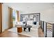 Comfortable living room with a modern white sofa, stylish decor, and hardwood floors at 14210 Kershaw Cir # 20, Huntersville, NC 28078