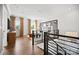 Stylish loft area with hardwood floors, modern furniture, and decorative wall accents at 14210 Kershaw Cir # 20, Huntersville, NC 28078
