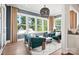 Comfortable sitting room with large windows offering abundant natural light and great views at 14210 Kershaw Cir # 20, Huntersville, NC 28078