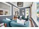 Cozy sitting room with modern decor, ample natural light, and hardwood floors at 14210 Kershaw Cir # 20, Huntersville, NC 28078