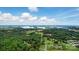 Expansive aerial view showcasing the community's beautiful lake, lush greenery, and stunning landscape at 14316 Baytown Ct, Charlotte, NC 28078