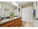 Bathroom with double vanity, granite counters, and a shower-tub combination at 14316 Baytown Ct, Charlotte, NC 28078