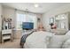 Bright bedroom featuring a ceiling fan, large windows with natural light, and neutral paint at 14316 Baytown Ct, Charlotte, NC 28078