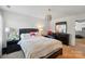 Well lit bedroom showcasing a neutral color scheme, carpet flooring, and natural light at 14316 Baytown Ct, Charlotte, NC 28078