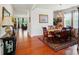 Formal dining room featuring hardwood floors, a chandelier, and an elegant dining set at 14316 Baytown Ct, Charlotte, NC 28078