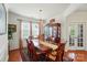 Formal dining room featuring hardwood floors, a chandelier, and an elegant dining set at 14316 Baytown Ct, Charlotte, NC 28078
