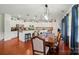 Dining room with hardwood floors and view to the kitchen at 14316 Baytown Ct, Charlotte, NC 28078