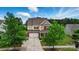 Charming two-story home with brick and beige siding, mature trees, and inviting curb appeal at 14316 Baytown Ct, Charlotte, NC 28078
