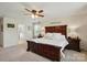 Bright main bedroom featuring a dark wood bed frame and matching nightstands at 14316 Baytown Ct, Charlotte, NC 28078