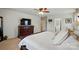 Main bedroom with white walls, a ceiling fan, a dresser, and access to a bathroom at 14316 Baytown Ct, Charlotte, NC 28078