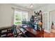 Well-lit home office with large windows, desk, and ample space for a productive work environment at 14316 Baytown Ct, Charlotte, NC 28078