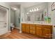 Bathroom with double vanity, walk-in shower and wooden cabinets at 144 Chickasaw Dr, Shelby, NC 28152
